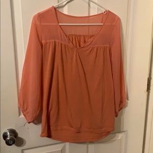 It’s a peach colored dressy t shirt